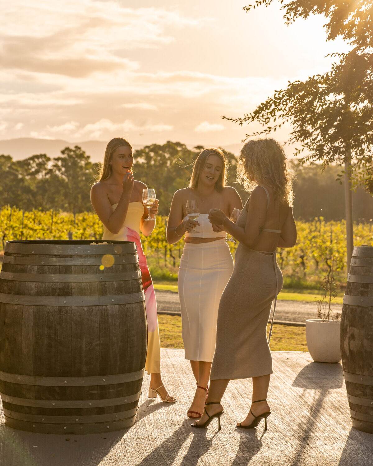 Guests enjoying wine at golden hour on the terrace at Estancia Adina